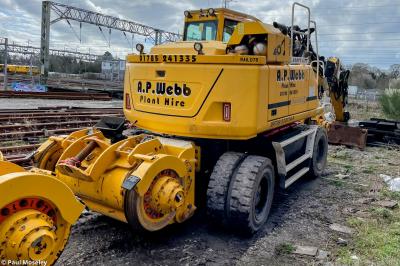 image showing a large yellow on-track machine
