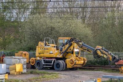 image showing a large yellow on-track machine