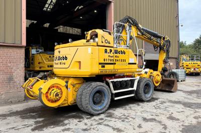 image showing a large yellow on-track machine