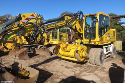 image showing a large yellow on-track machine