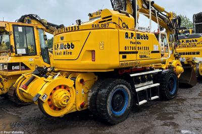 image showing a large yellow on-track machine