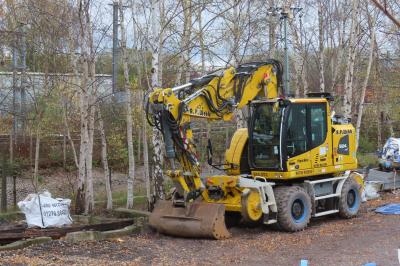 image showing a large yellow on-track machine