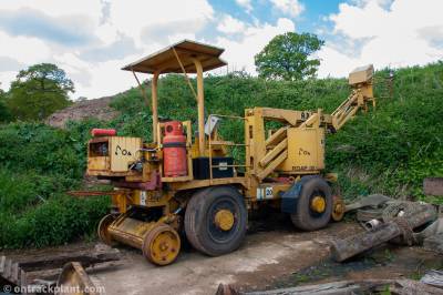 image showing a large yellow on-track machine
