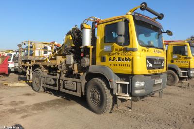 image showing a large yellow on-track machine
