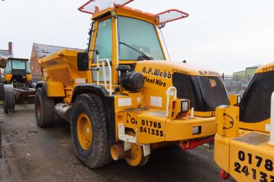 image showing a large yellow on-track machine