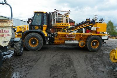 image showing a large yellow on-track machine