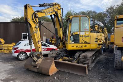 image showing a large yellow on-track machine