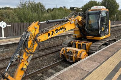 image showing a large yellow on-track machine