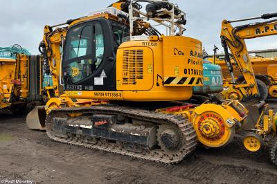image showing a large yellow on-track machine