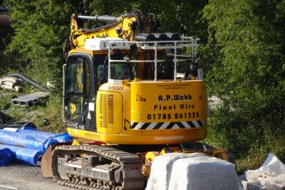 image showing a large yellow on-track machine