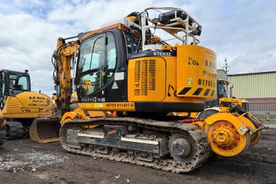 image showing a large yellow on-track machine