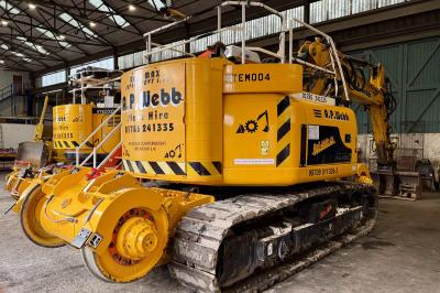 image showing a large yellow on-track machine