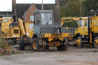image showing a large yellow on-track machine