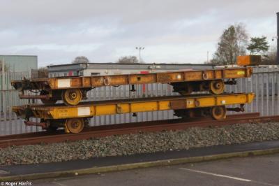image showing a large yellow on-track machine
