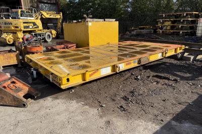 image showing a large yellow on-track machine