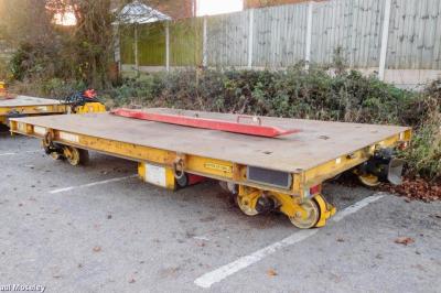 image showing a large yellow on-track machine