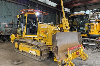 image showing a large yellow on-track machine