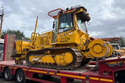 image showing a large yellow on-track machine