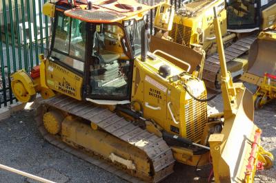 image showing a large yellow on-track machine
