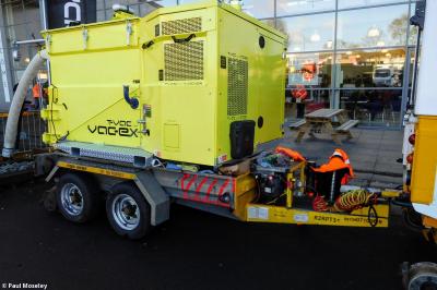 image showing a large yellow on-track machine
