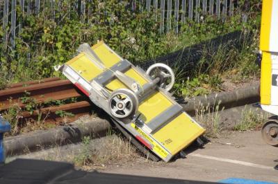 image showing a large yellow on-track machine