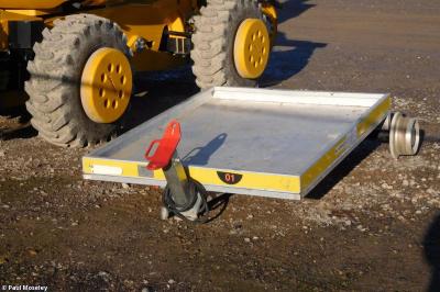 image showing a large yellow on-track machine