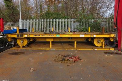 image showing a large yellow on-track machine