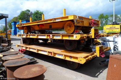 image showing a large yellow on-track machine