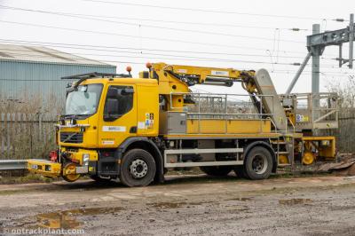 image showing a large yellow on-track machine