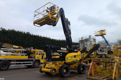 image showing a large yellow on-track machine