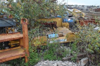 image showing a large yellow on-track machine
