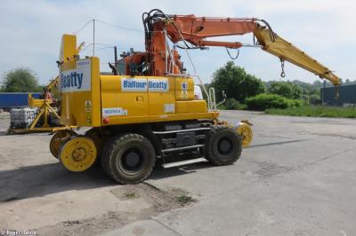 image showing a large yellow on-track machine