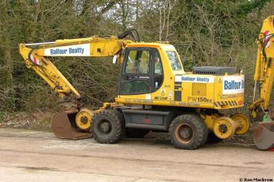 image showing a large yellow on-track machine