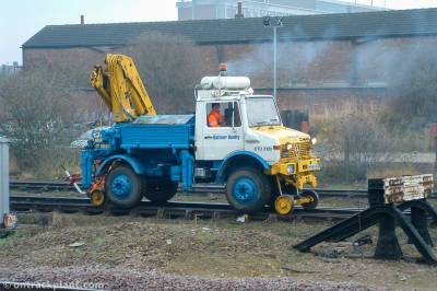 image showing a large yellow on-track machine