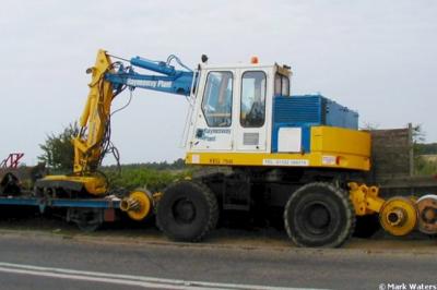 image showing a large yellow on-track machine