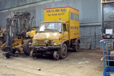 image showing a large yellow on-track machine