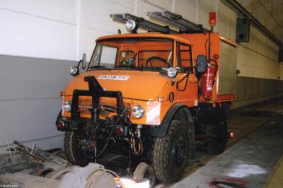 image showing a large yellow on-track machine