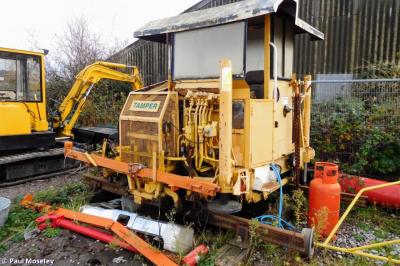 image showing a large yellow on-track machine