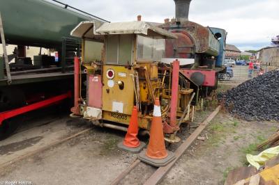 image showing a large yellow on-track machine