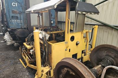 image showing a large yellow on-track machine