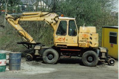 image showing a large yellow on-track machine
