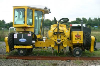 image showing a large yellow on-track machine
