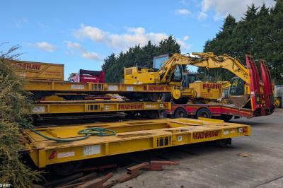 image showing a large yellow on-track machine