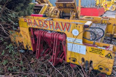 image showing a large yellow on-track machine