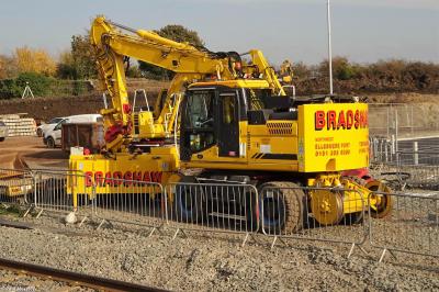 image showing a large yellow on-track machine