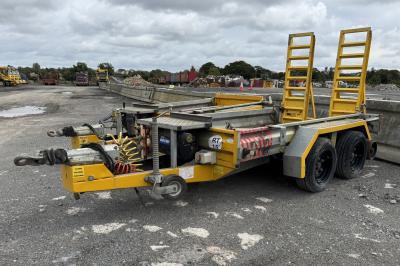 image showing a large yellow on-track machine
