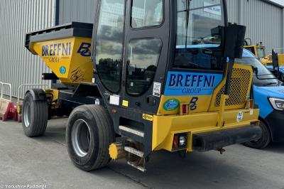 image showing a large yellow on-track machine