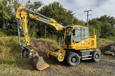 image showing a large yellow on-track machine