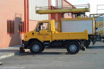 image showing a large yellow on-track machine