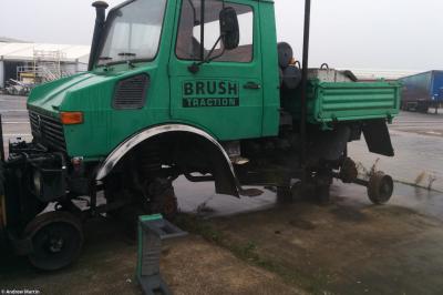 image showing a large yellow on-track machine